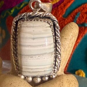 Blue Lace Agate pendant. Set in .925 Sterling Silver
Beautiful soft colors